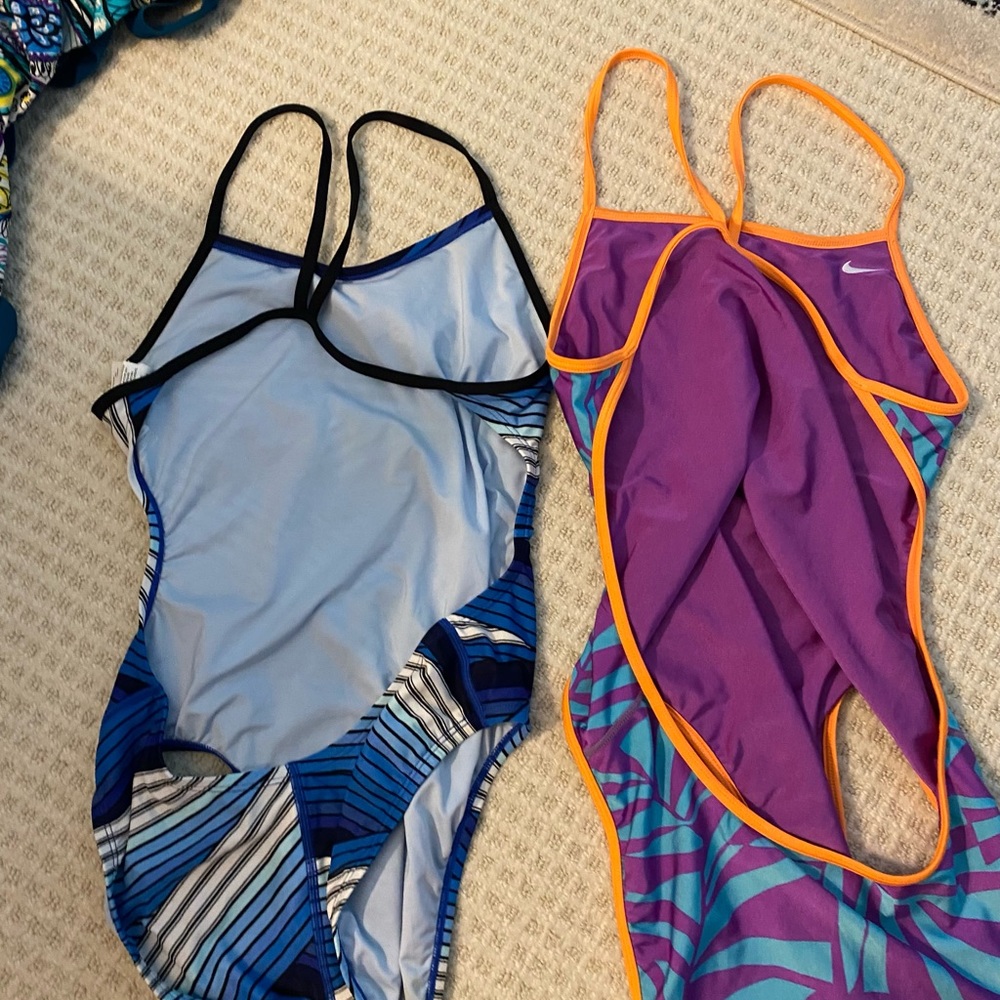 2 athletic Nike suits